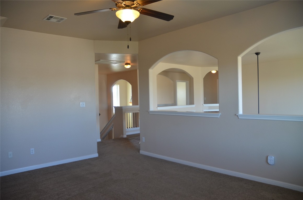 8528 Reggio Street Round Rock, TX 78665 - Photo 18 of 27 a view of a livingroom with a staircase