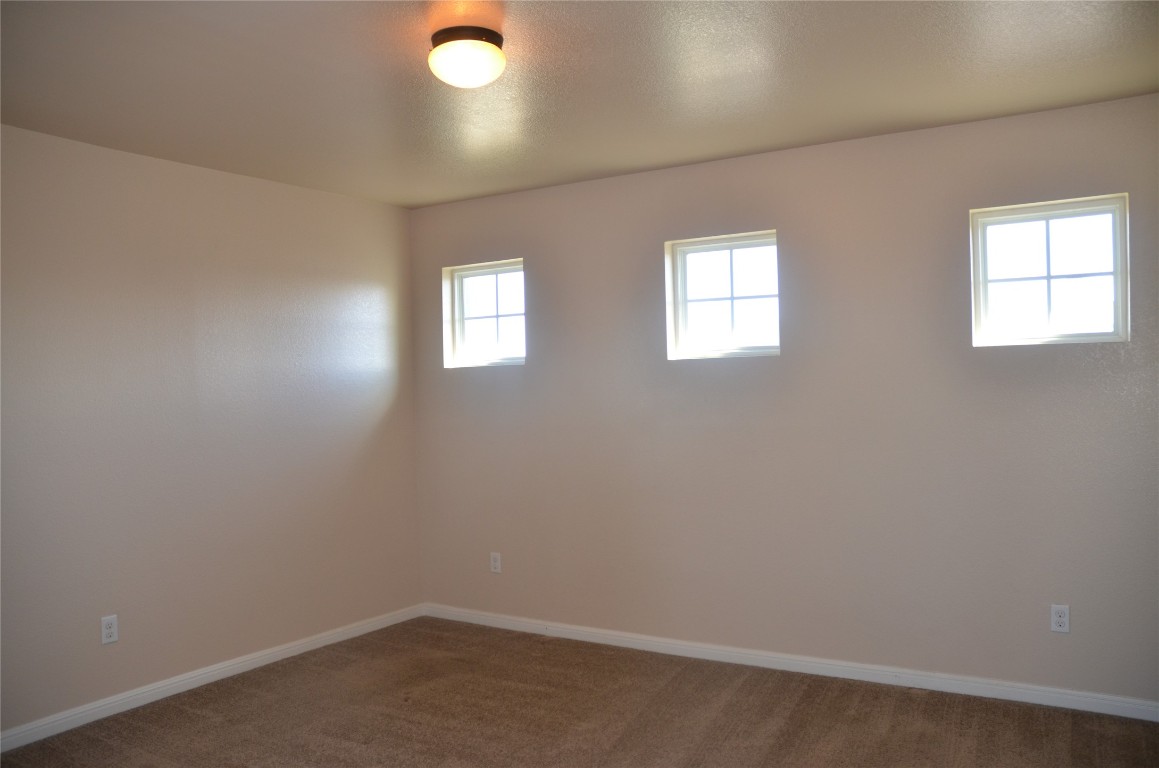 8528 Reggio Street Round Rock, TX 78665 - Photo 25 of 27 an empty room with windows