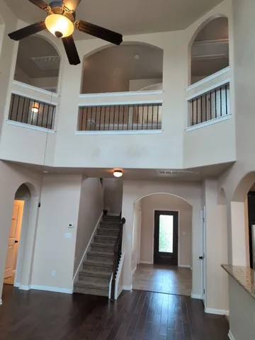 a hallway with windows and stairs