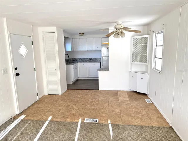 a view of a kitchen with a stove cabinets and a kitchen