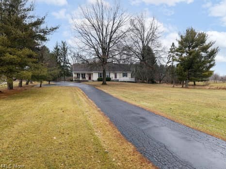 4293 Good Road Seville, OH 44273 - Photo 8 of 35 Ranch-style house with a front yard and asphalt driveway