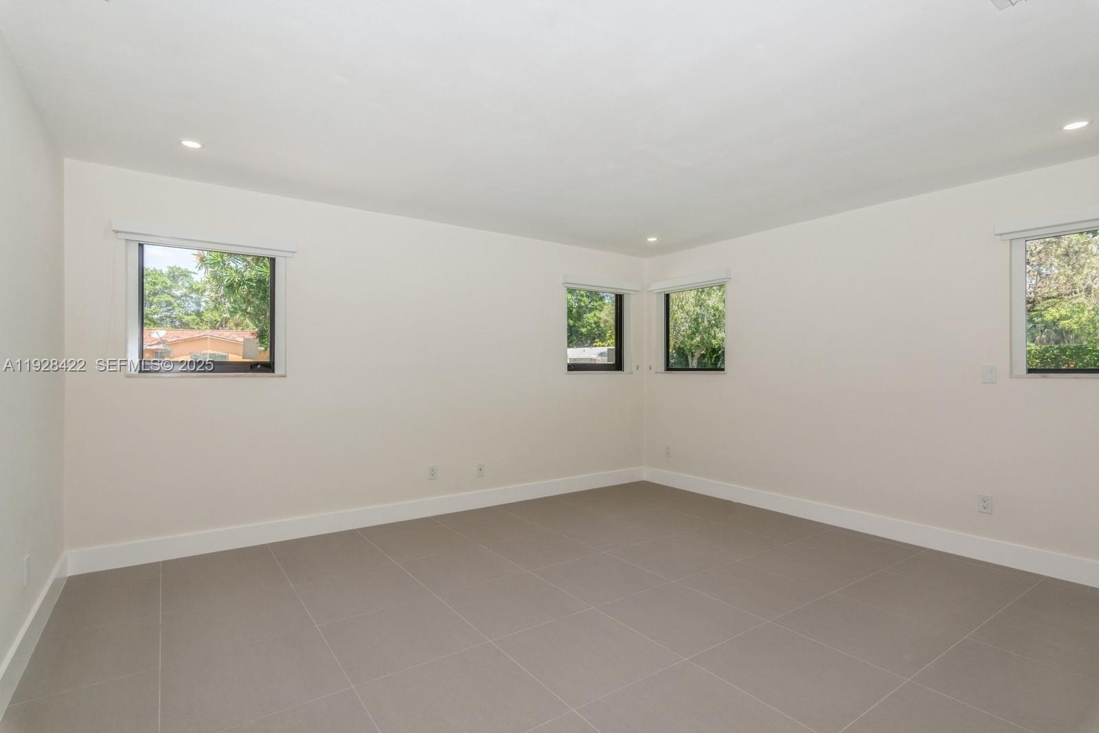 7001 Southwest 126th Street Pinecrest, FL 33156 - Photo 11 of 35 an empty room with windows