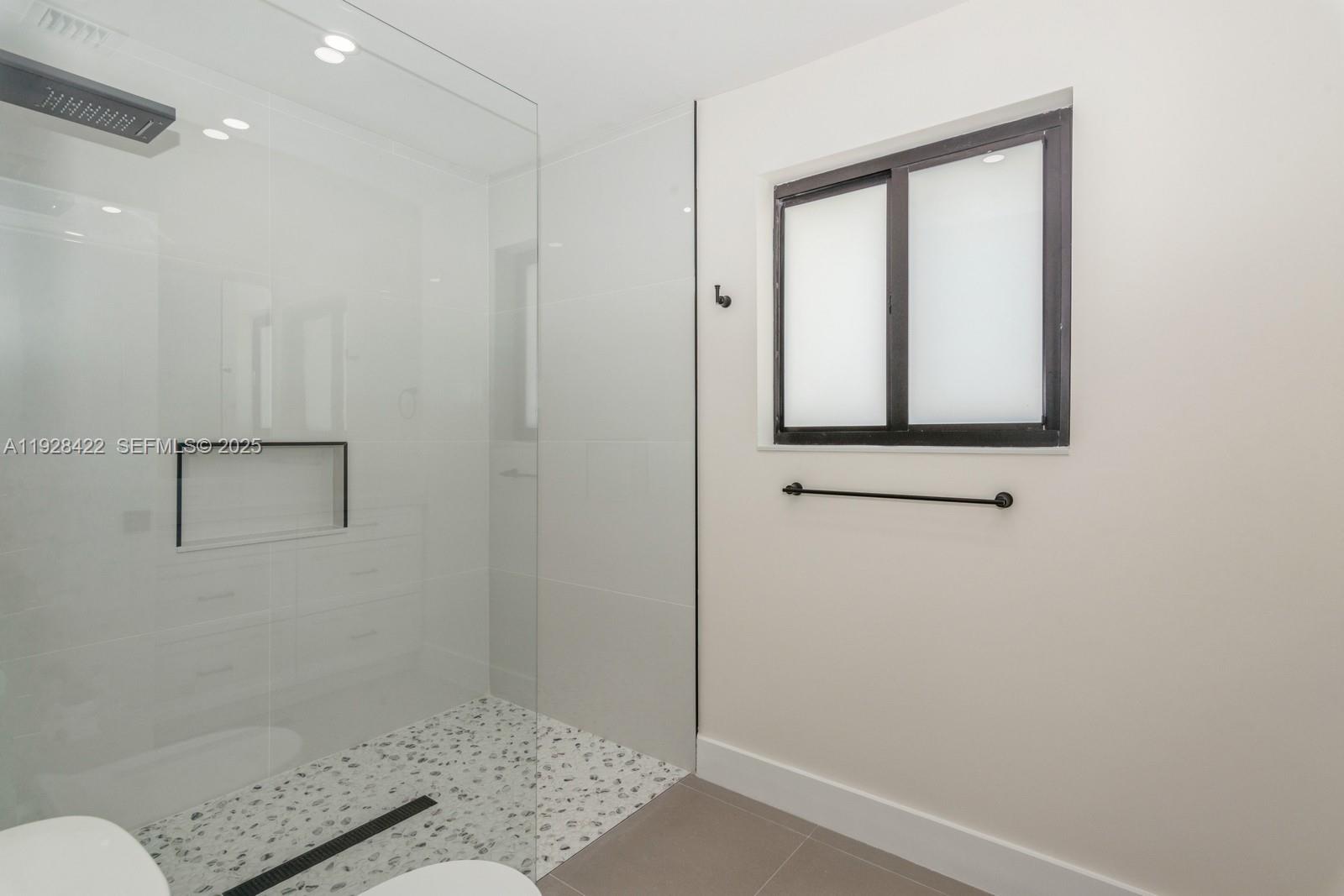 7001 Southwest 126th Street Pinecrest, FL 33156 - Photo 12 of 35 a bathroom with a sink and a mirror