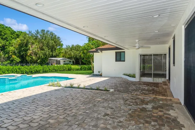 a house view with a backyard space