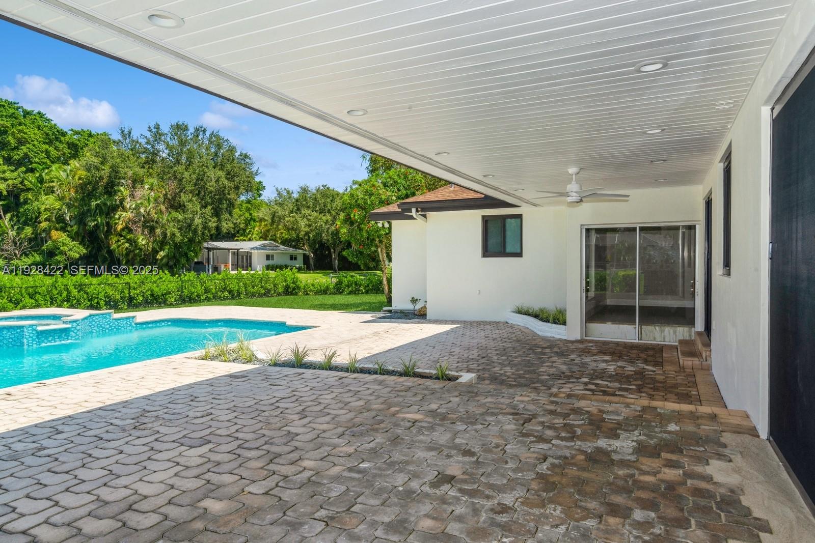7001 Southwest 126th Street Pinecrest, FL 33156 - Photo 22 of 35 a house view with a backyard space