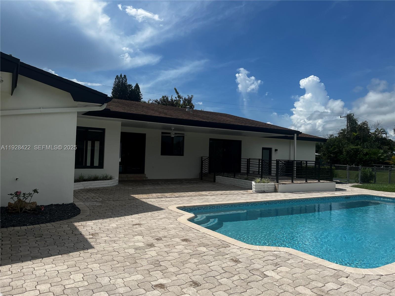 7001 Southwest 126th Street Pinecrest, FL 33156 - Photo 23 of 35 a view of a house with a patio