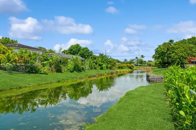 a view of a lake with a big yard