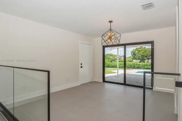 a view of room with window and ceiling fan