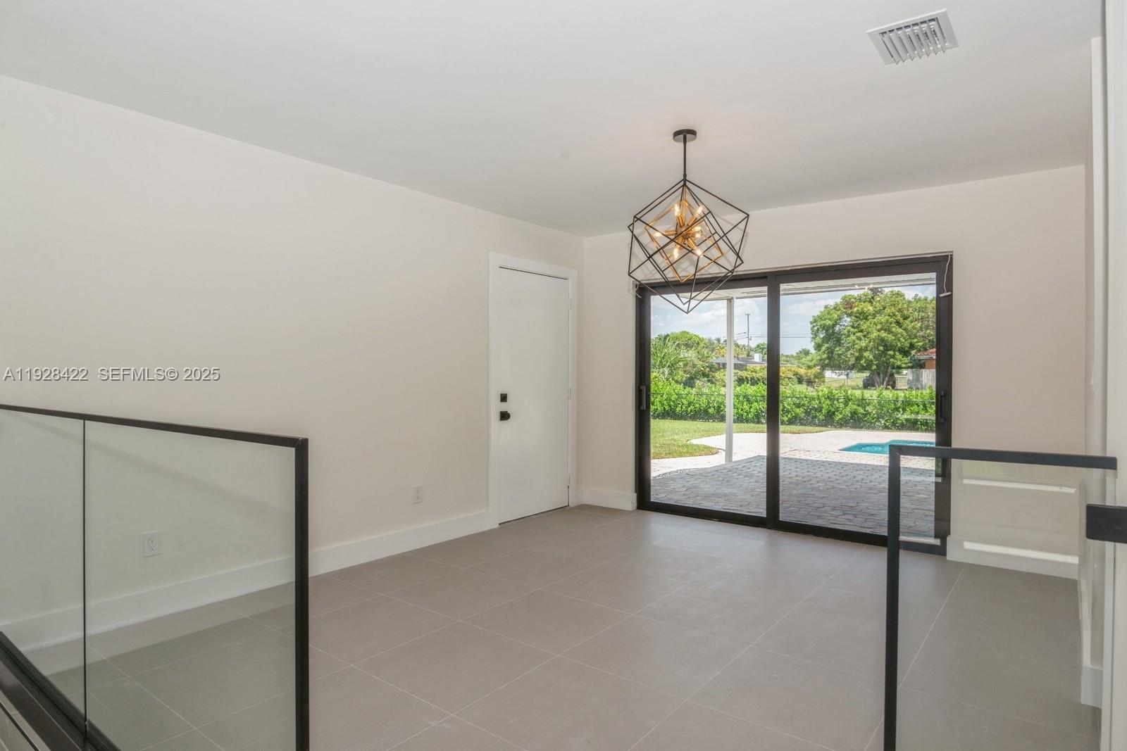 7001 Southwest 126th Street Pinecrest, FL 33156 - Photo 8 of 35 a view of room with window and ceiling fan
