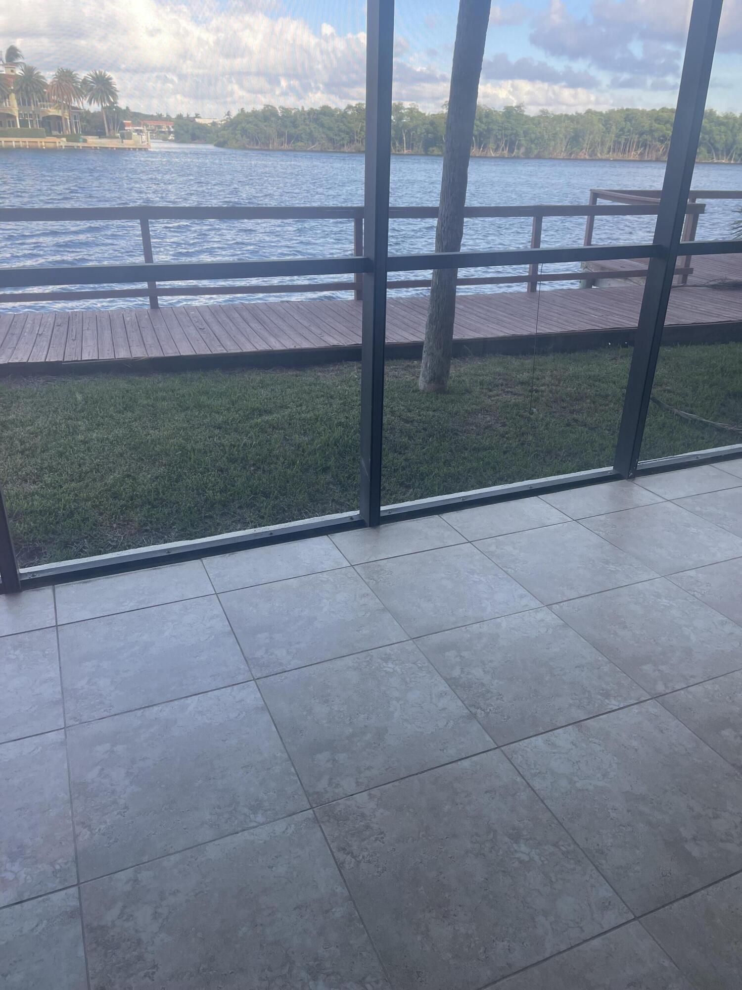 710 Northeast 7th Street, Unit 103 Boynton Beach, FL 33435 - Photo 1 of 12 a view of backyard with green space