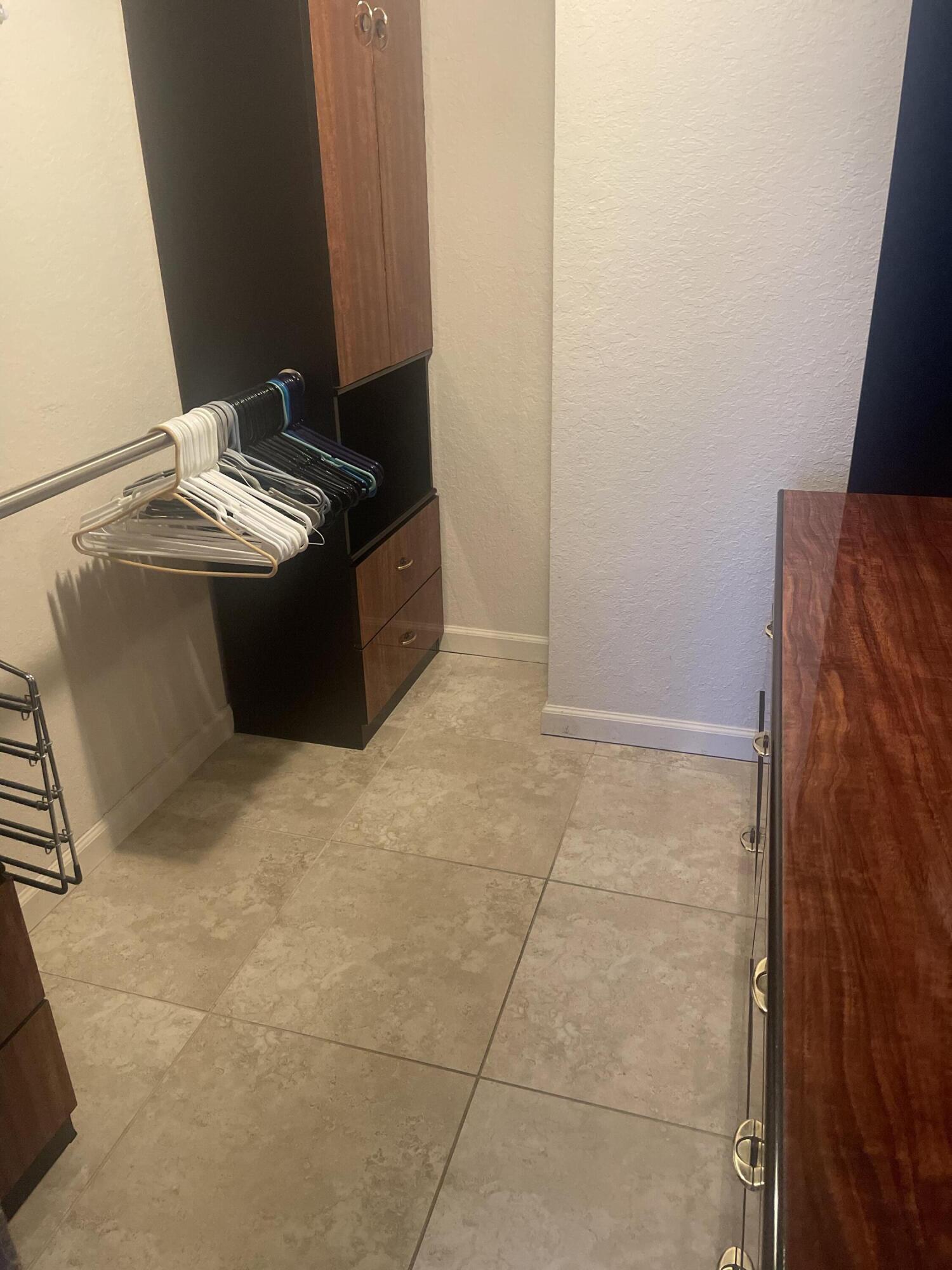 710 Northeast 7th Street, Unit 103 Boynton Beach, FL 33435 - Photo 12 of 12 a bathroom with a granite countertop sink and a mirror