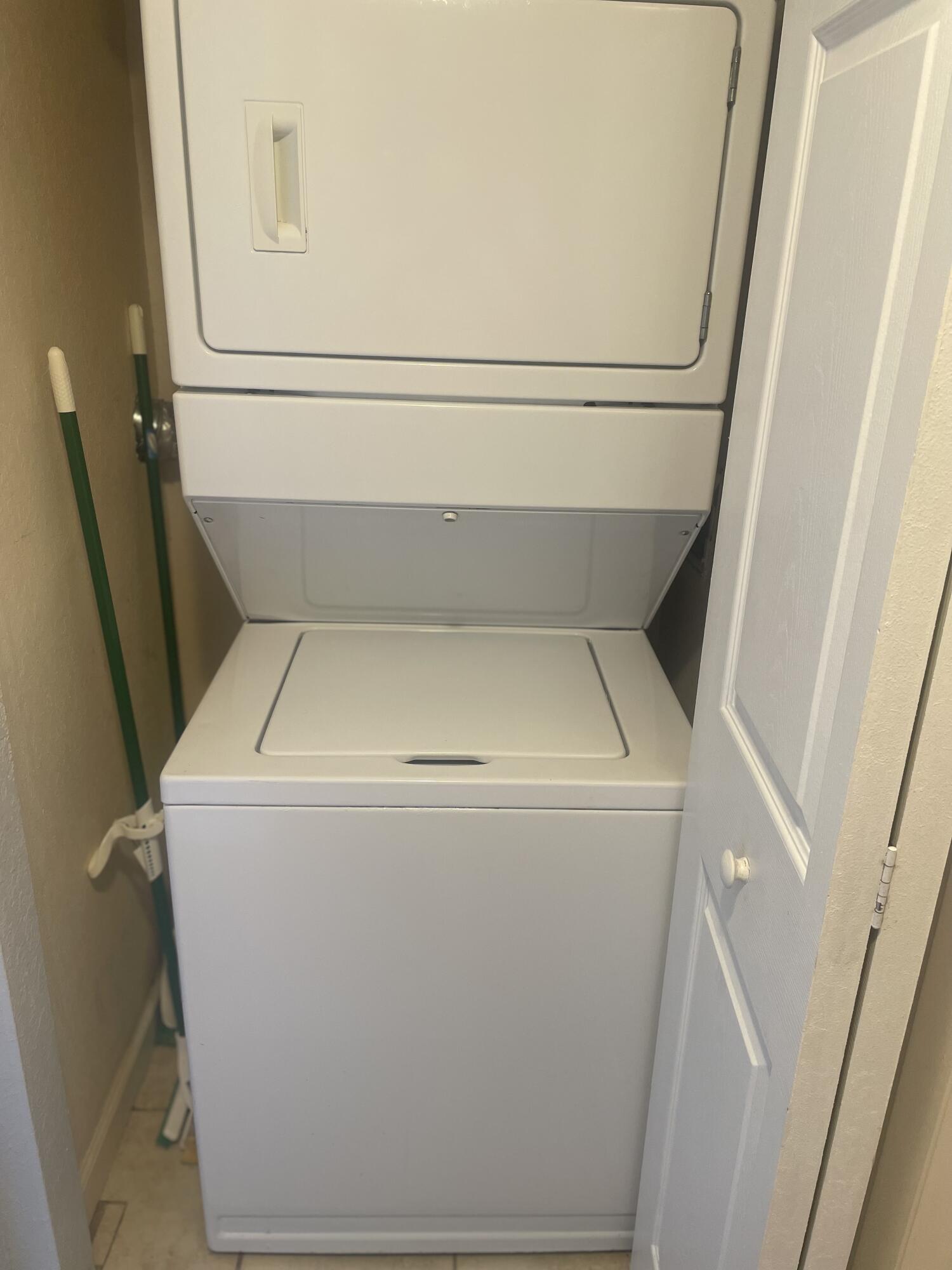 710 Northeast 7th Street, Unit 103 Boynton Beach, FL 33435 - Photo 10 of 12 a utility room with dryer and washer