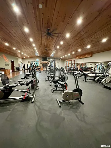 a kitchen with stainless steel appliances granite countertop a refrigerator a stove and a sink