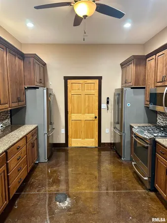 a bathroom with a sink toilet and mirror