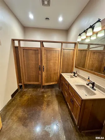 a bedroom with a bed and a mirror