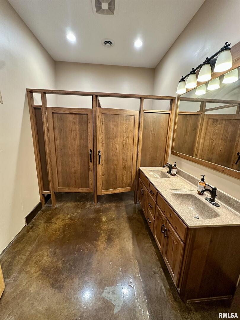 20 Ashley Lane Casey, IL 62420 - Photo 32 of 98 a bathroom with a double vanity sink and a mirror