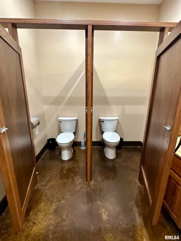 a bedroom with a large bed and a ceiling fan