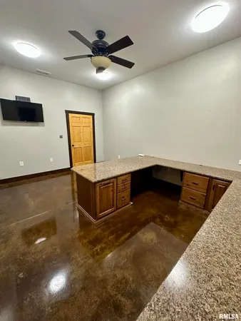 a living room with furniture and a chair