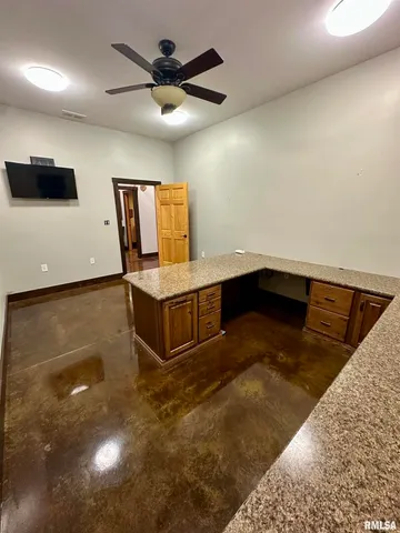a living room with furniture a rug and a wooden floor