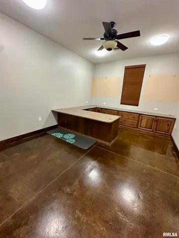 a bedroom with a bed and a chair