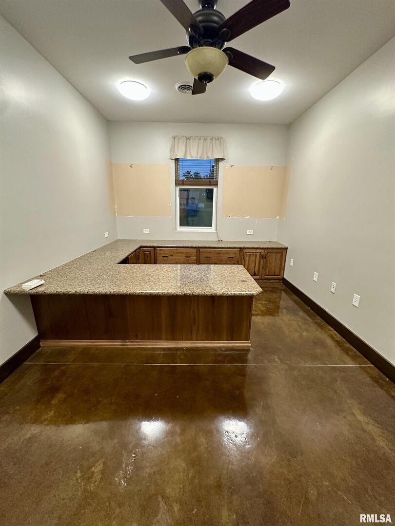 20 Ashley Lane Casey, IL 62420 - Photo 40 of 98 a living room with a bed furniture and a ceiling fan