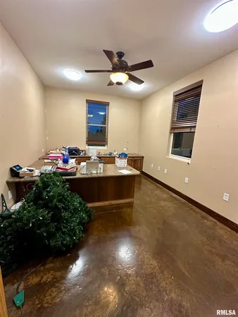 a view of a backyard with plants and outdoor seating