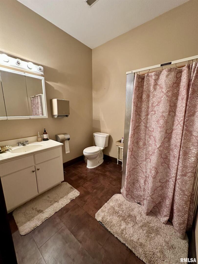 20 Ashley Lane Casey, IL 62420 - Photo 59 of 98 a bathroom with a sink and a mirror