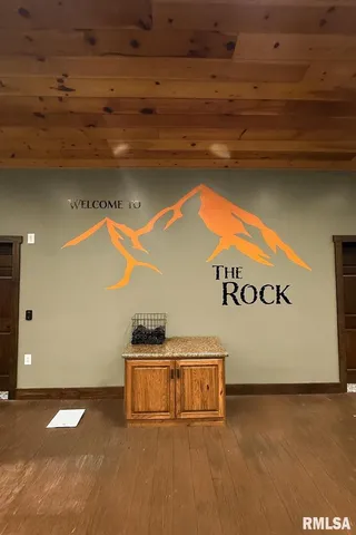 a kitchen with stainless steel appliances wooden cabinets and a counter top space