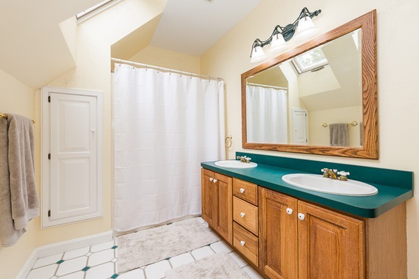 8 Old Town Road Beverly, MA 01915 - Photo 17 of 24 a bathroom with a granite countertop sink and a mirror