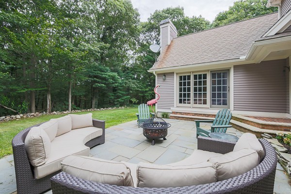 8 Old Town Road Beverly, MA 01915 - Photo 22 of 24 a view of a patio with couches chairs and a fire pit