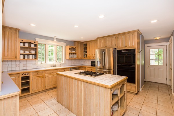 8 Old Town Road Beverly, MA 01915 - Photo 5 of 24 a kitchen that has a sink a stove and stainless steel appliances