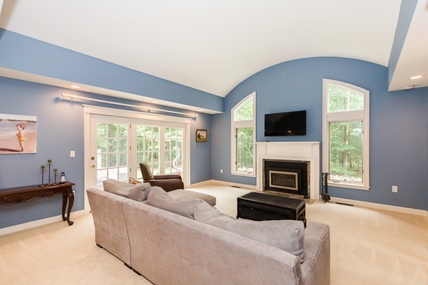 8 Old Town Road Beverly, MA 01915 - Photo 8 of 24 a living room with furniture a fireplace and a flat screen tv