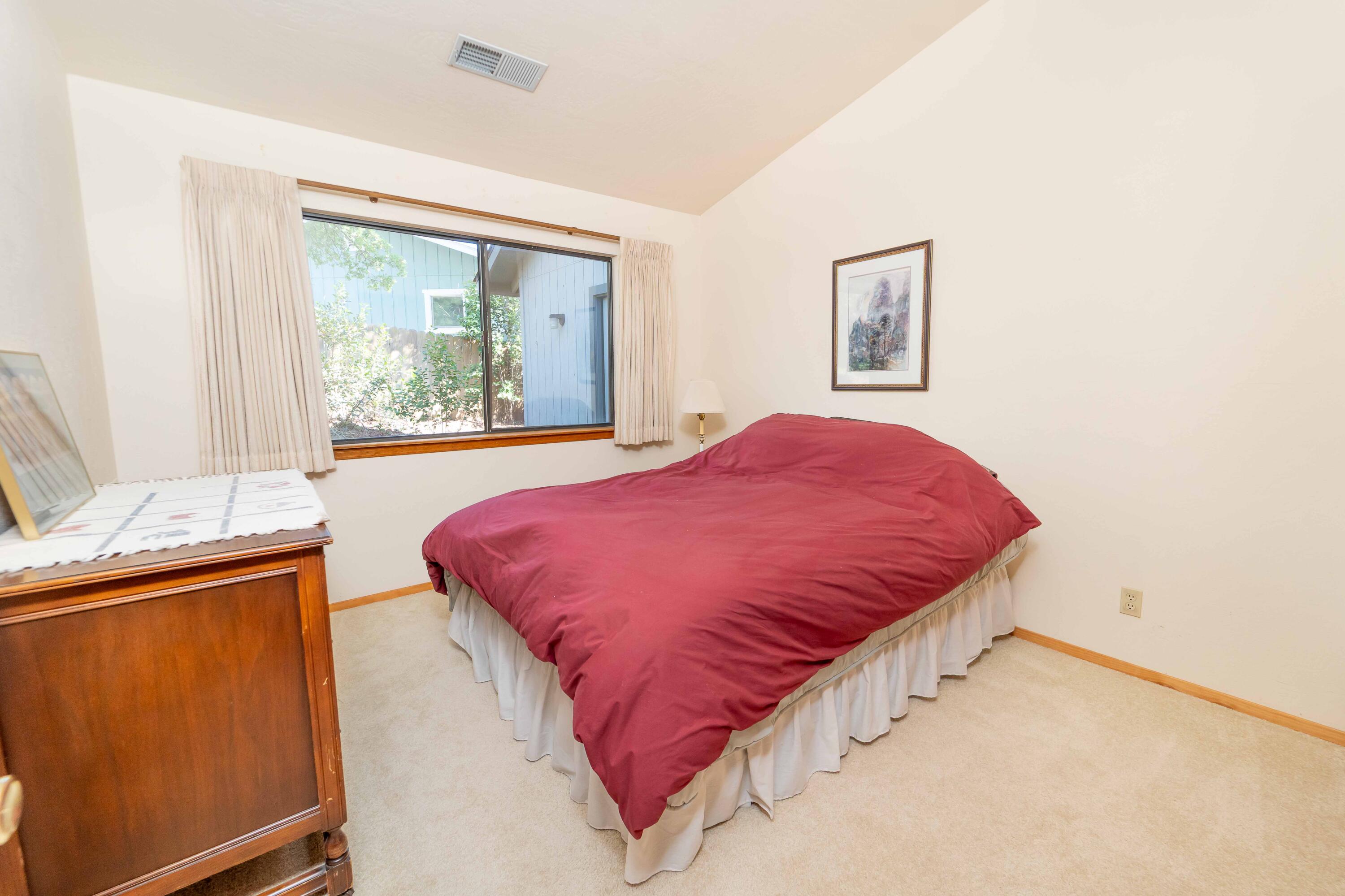 40962 Oak Ridge Drive Three Rivers, CA 93271 - Photo 18 of 36 a bed sitting in a bedroom next to a window