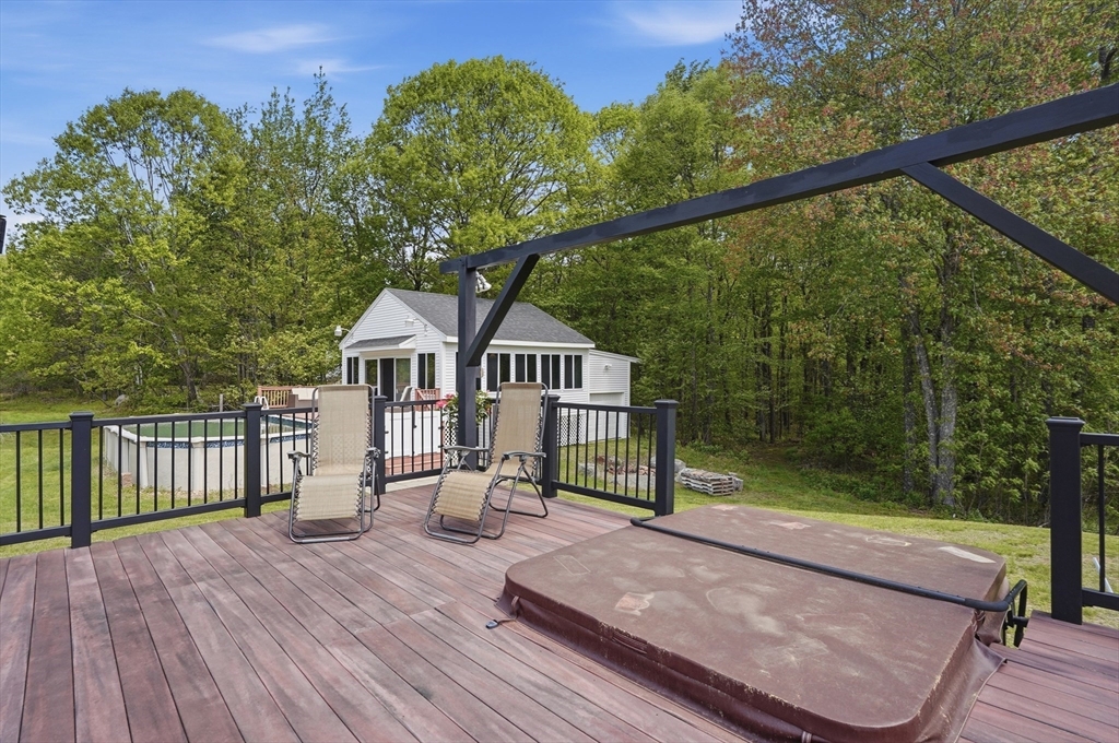 160 Gray Road Templeton, MA 01468 - Photo 4 of 42 a view of a deck with a table and chairs with wooden floor and fence