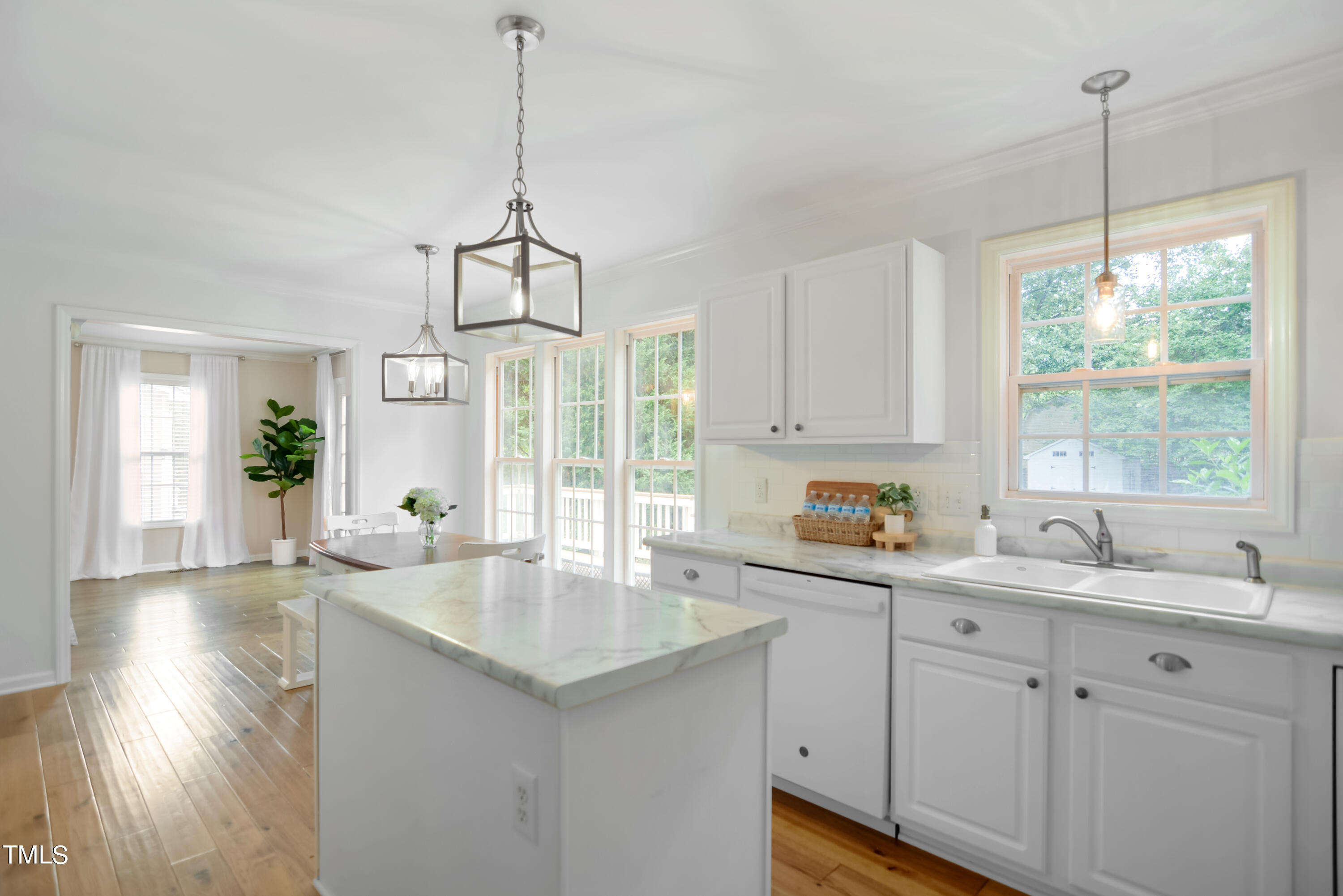 2515 Tryon Pines Drive Raleigh, NC 27603 - Photo 11 of 27 a kitchen with sink cabinets and wooden floor