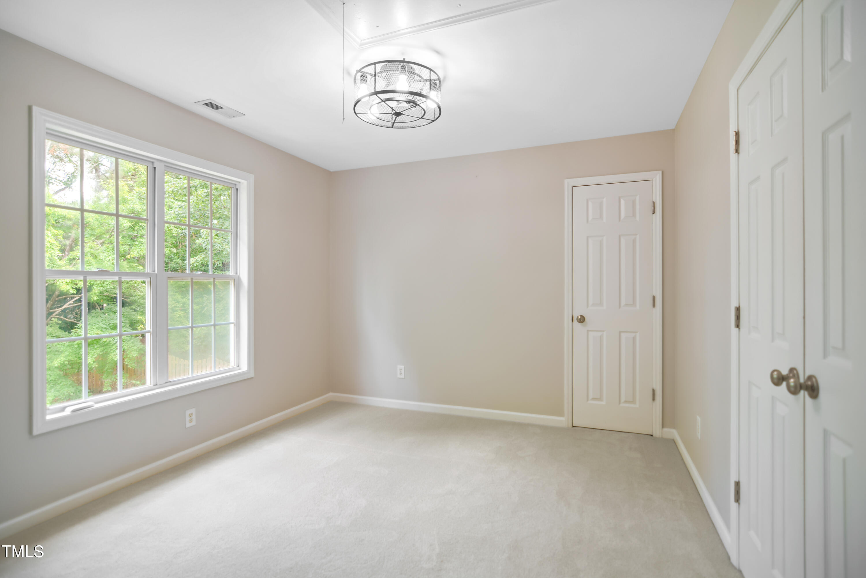 2515 Tryon Pines Drive Raleigh, NC 27603 - Photo 18 of 27 an empty room with a window