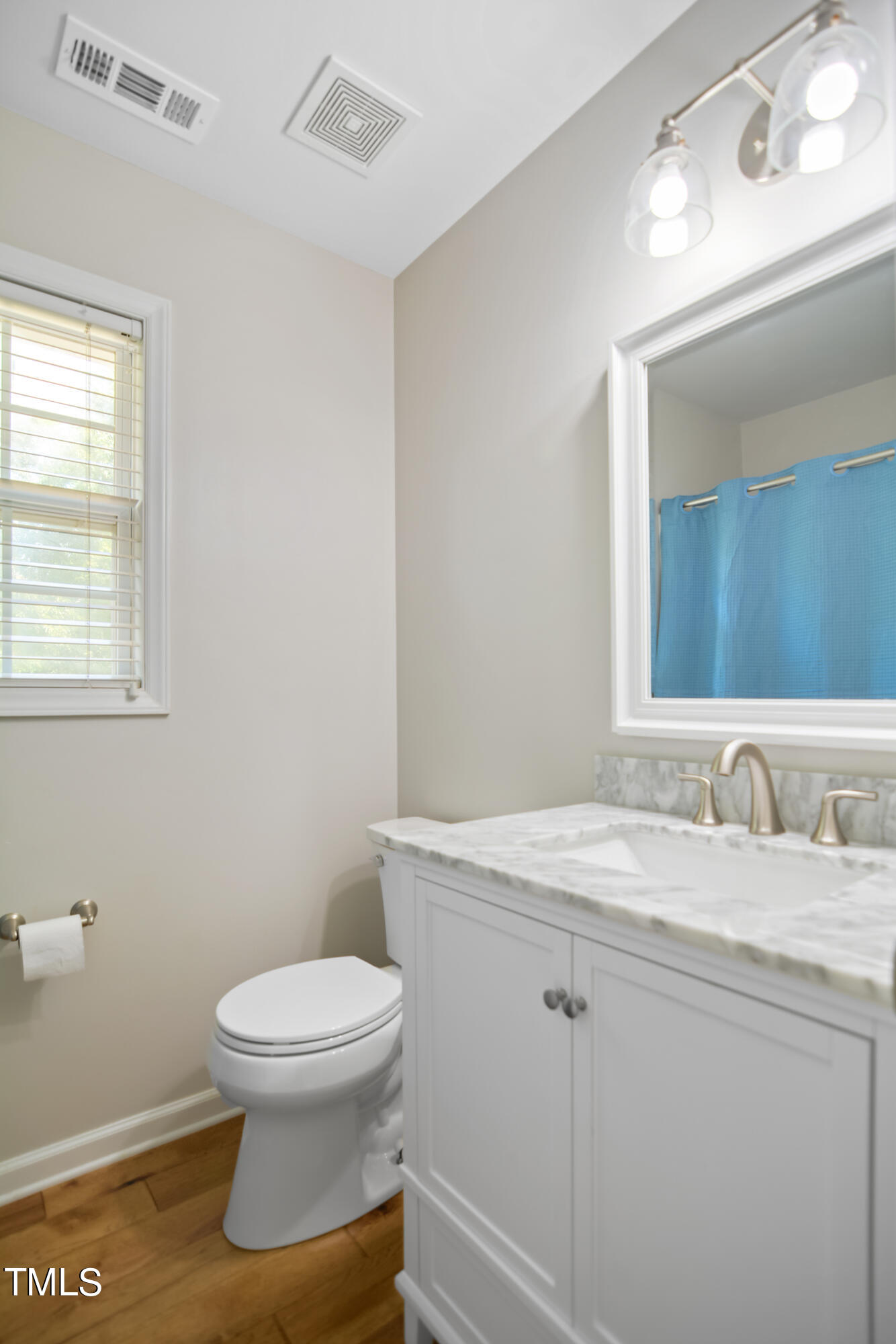 2515 Tryon Pines Drive Raleigh, NC 27603 - Photo 20 of 27 a bathroom with a granite countertop toilet sink and mirror