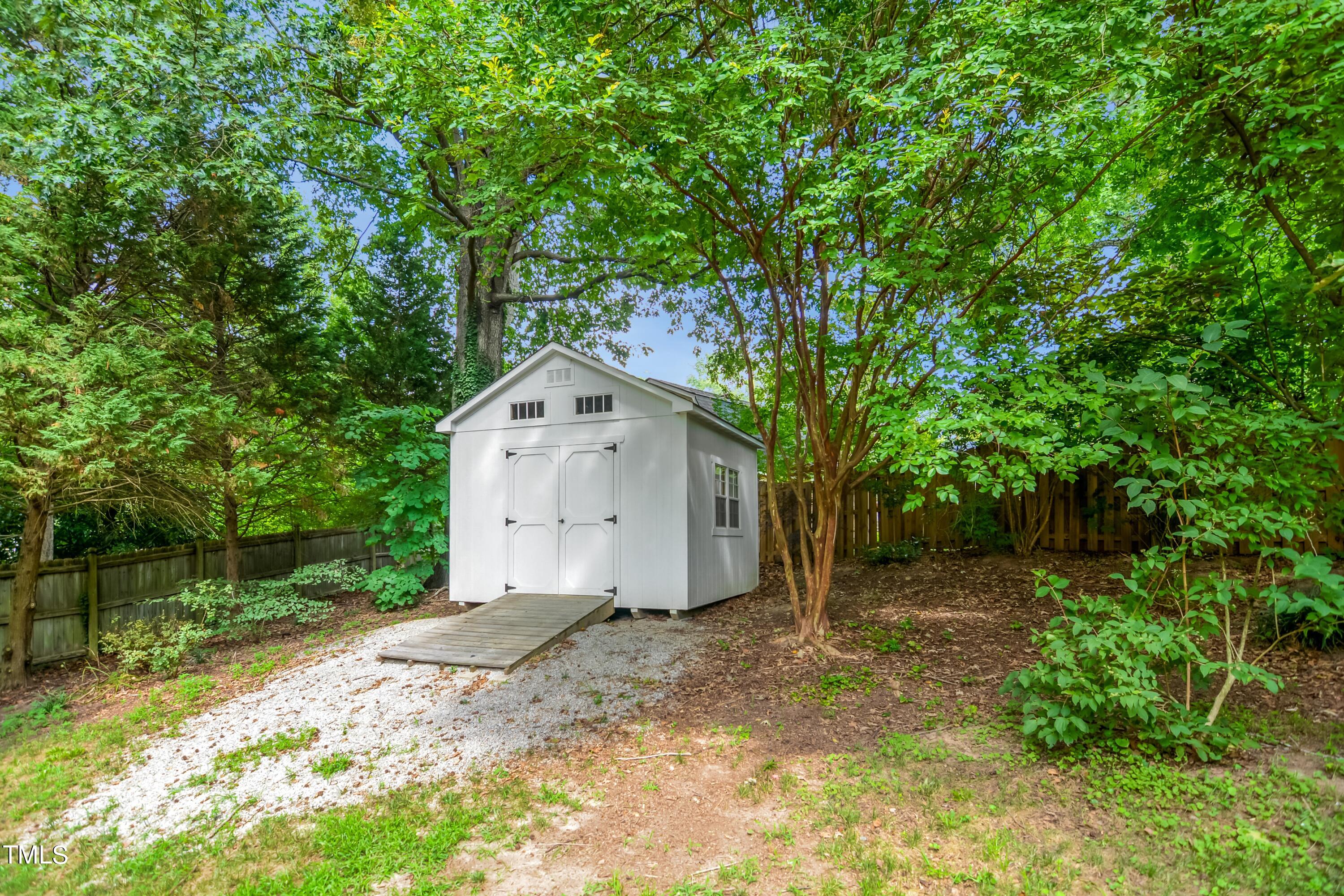 2515 Tryon Pines Drive Raleigh, NC 27603 - Photo 26 of 27 a view of a house with a yard and large tree