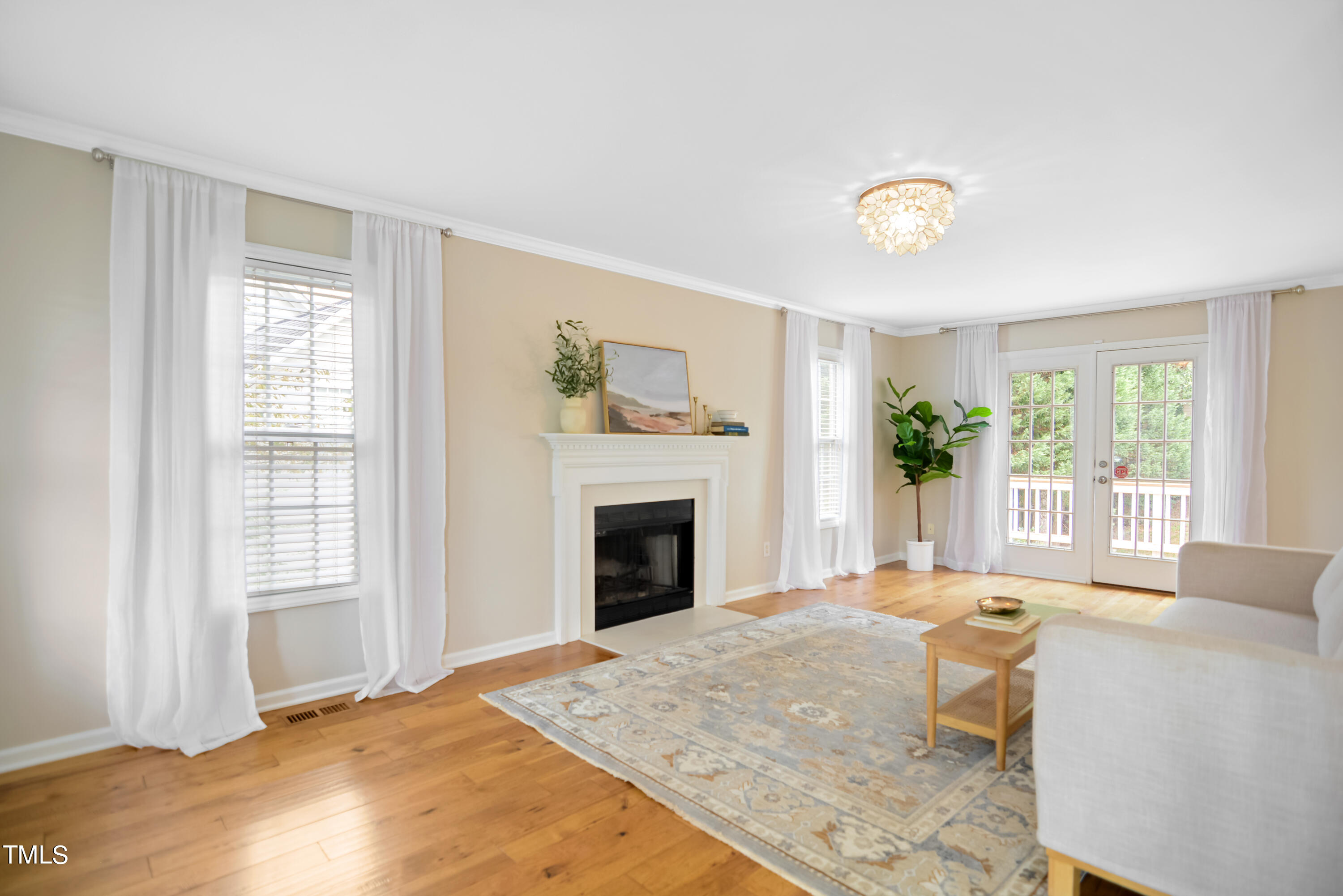 2515 Tryon Pines Drive Raleigh, NC 27603 - Photo 3 of 27 a bedroom with a bed and a fireplace