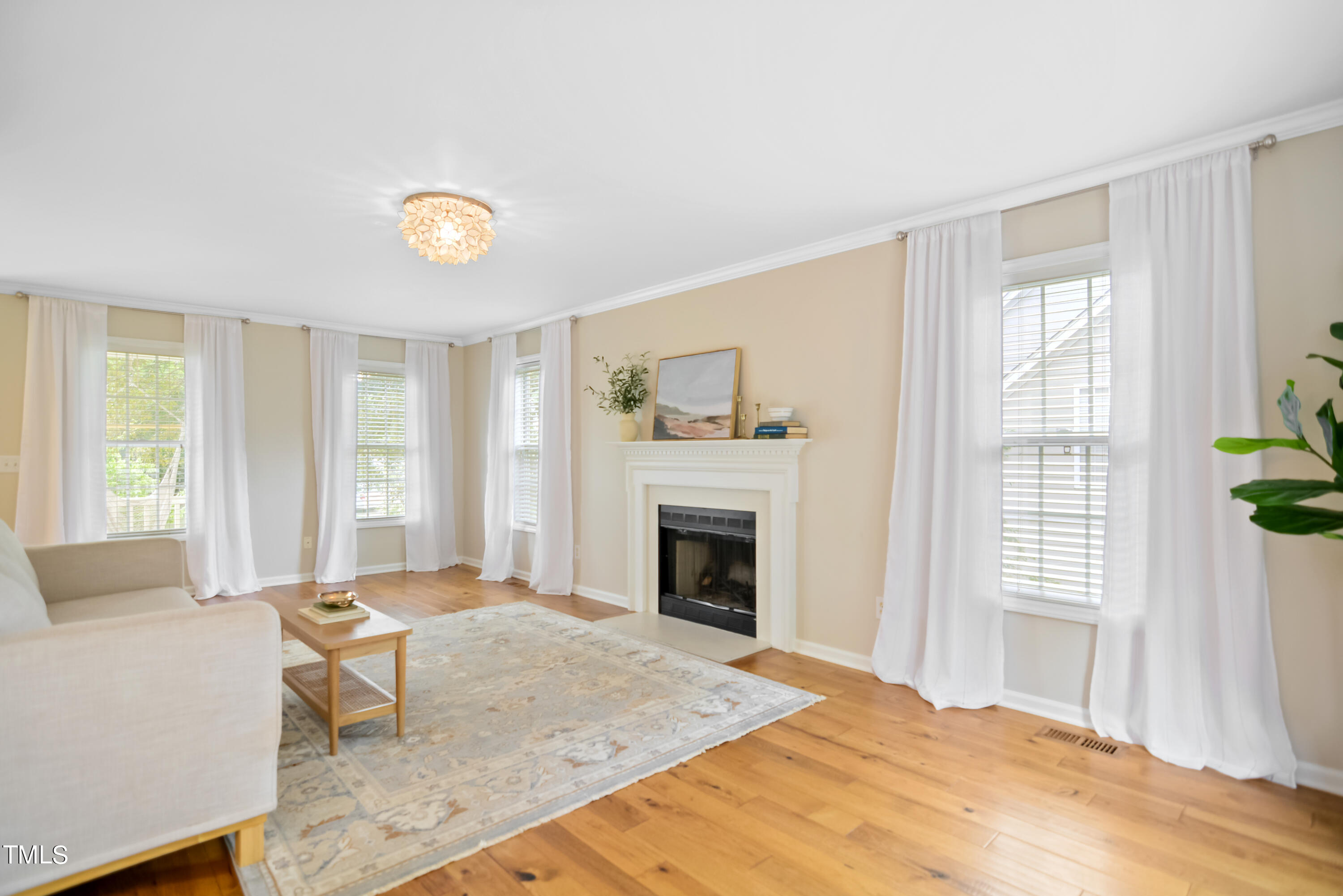 2515 Tryon Pines Drive Raleigh, NC 27603 - Photo 4 of 27 a bedroom with a bed and a fireplace