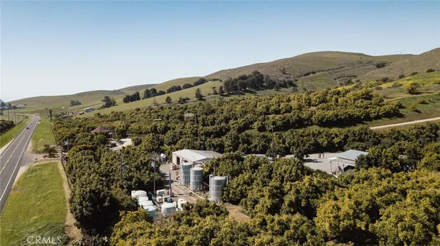 a view of a mountain range with lush green forest