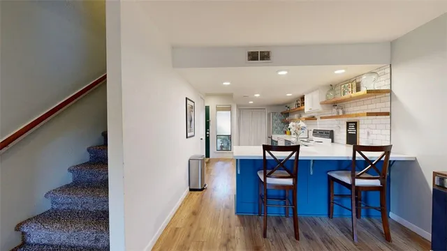 a bedroom with furniture and a lamp