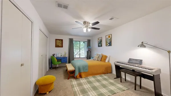 a bed room with a bed and a chandelier