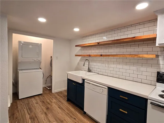 a view of storage and utility room with racks on the wall