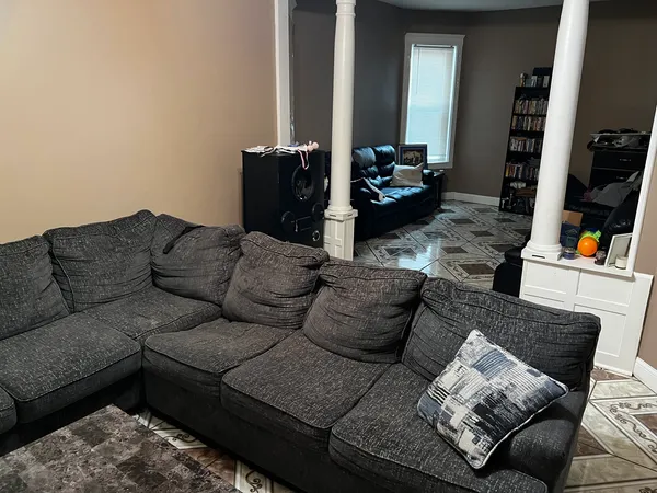 a living room with furniture and a couch