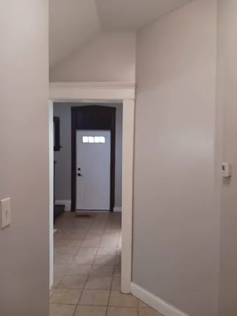 a view of an empty room with closet area