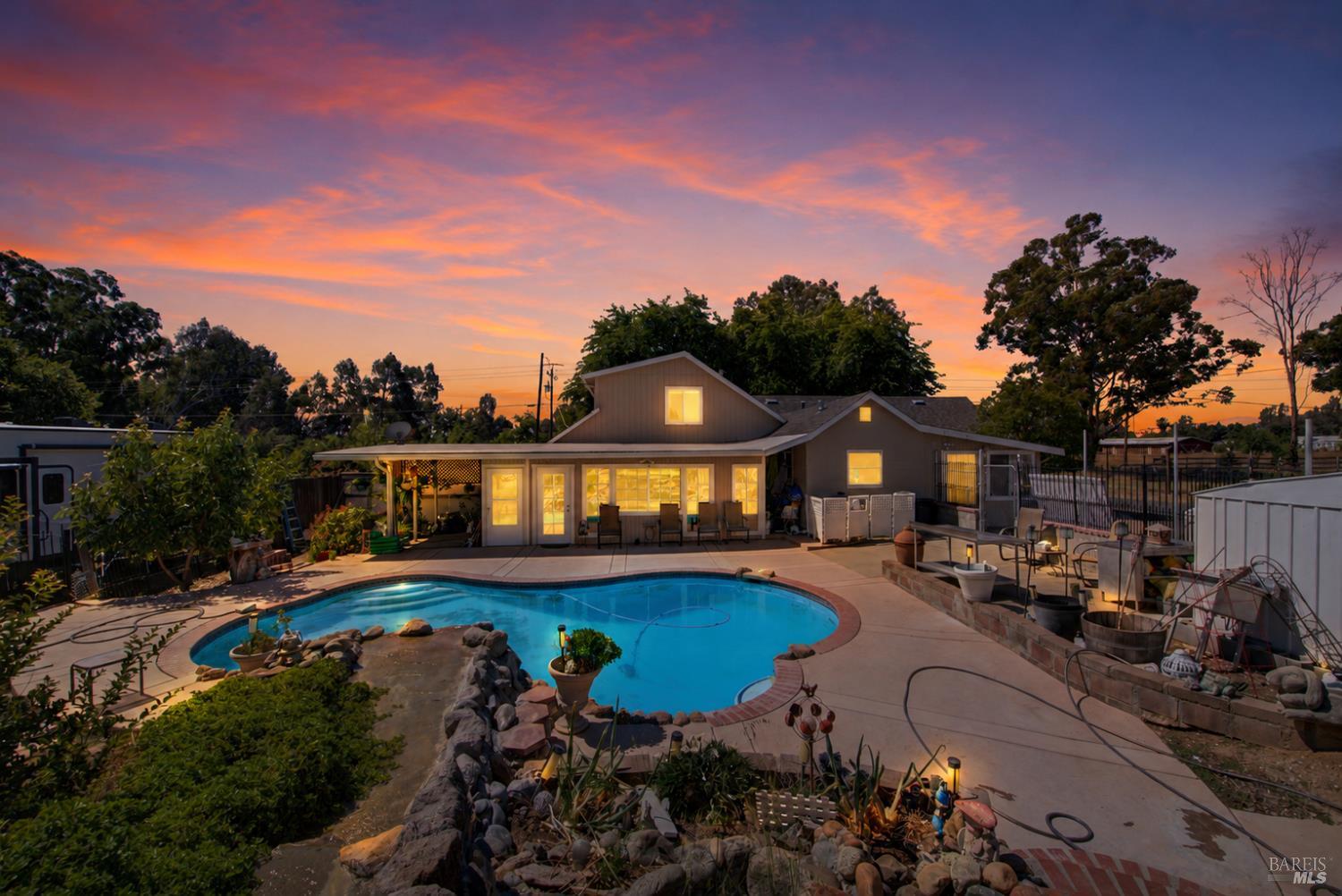 4851 Udell Road Vacaville, CA 95688 - Photo 63 of 65 a front view of a house with swimming pool having outdoor seating