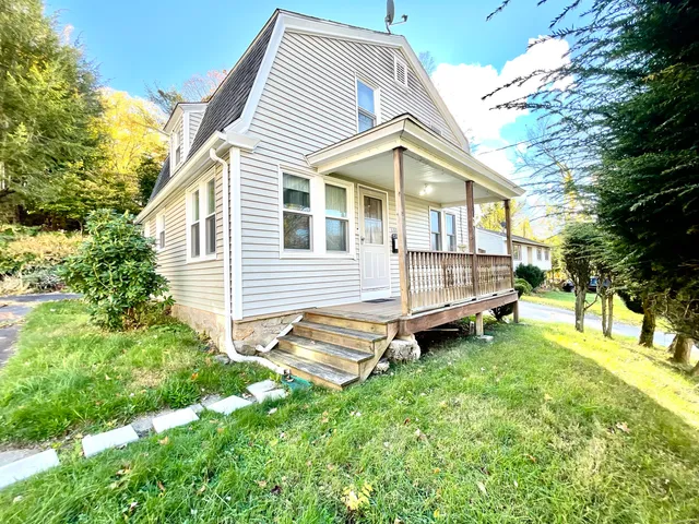 a view of a house with a yard