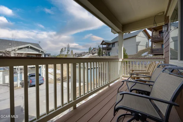 a view of a balcony with chairs