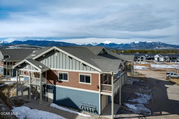 a view of a big house with wooden floor and city view